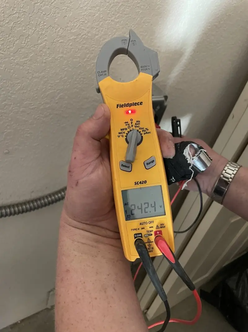 Voltage testing with clamp meter during Generator Installation in Tillamook